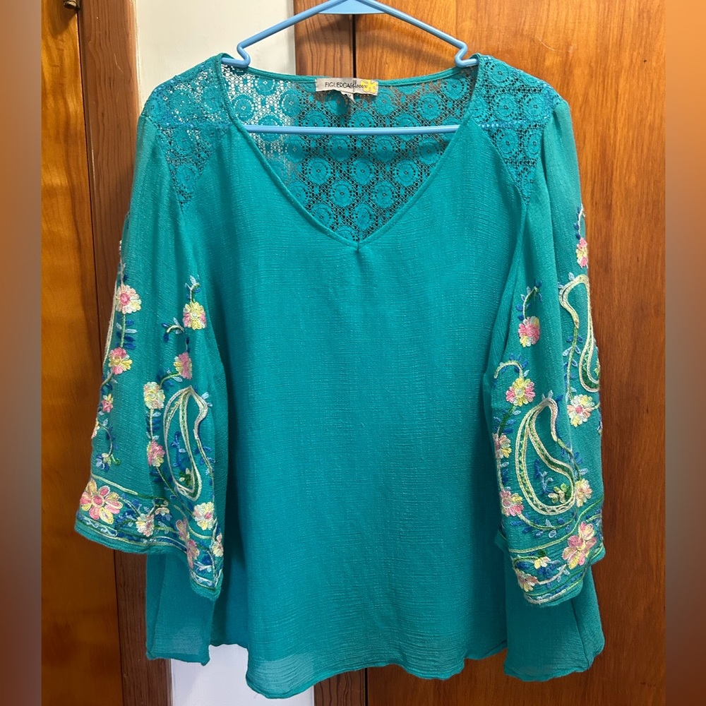 Embroidered Teal V-Neck Lace-Back Top with floral accents.